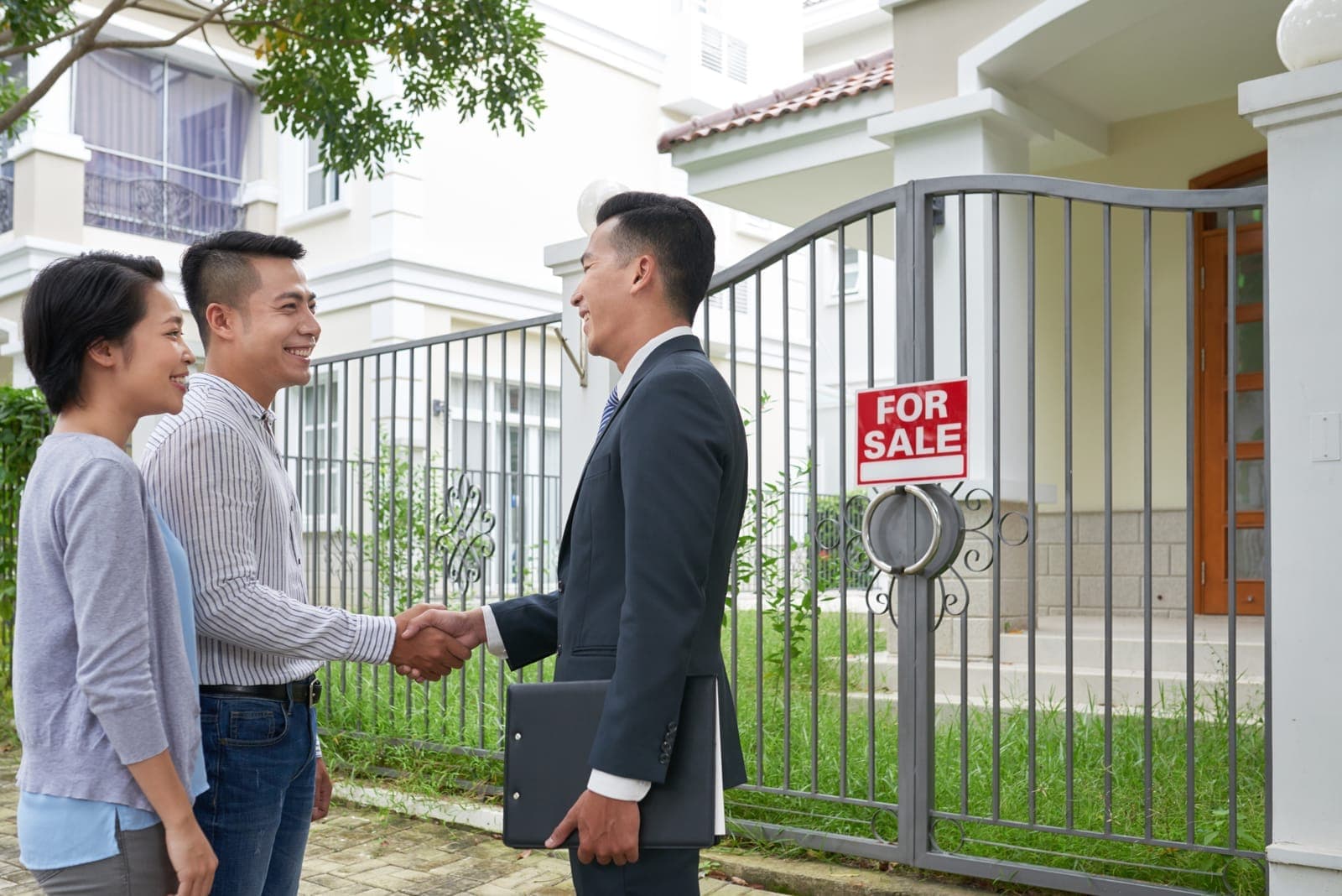 Two business partners shaking hands after setting up their company